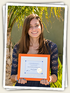 Olivia Gastaldo, 2014 Barbara Moulaison Awardee, proudly showing the certificate of her award