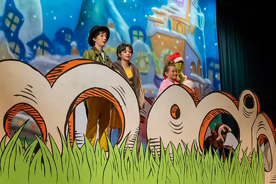Students perform on stage during a Mt. Helix Academy theatre production.